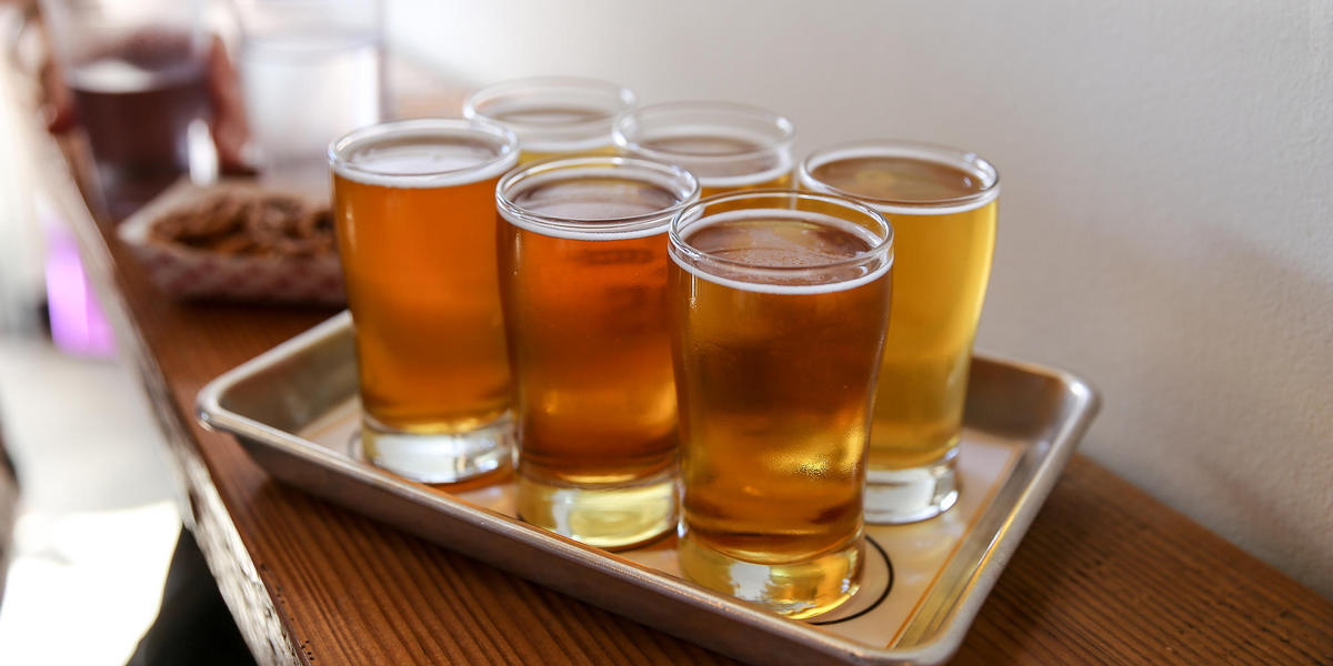 Glasses of beer on tray